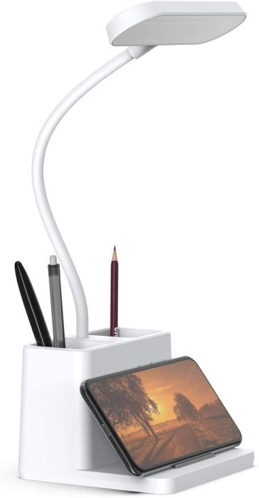 The desk lamp, with its built-in pen holder and phone rest, keeping everything in place.