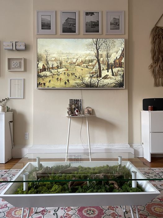 A moss-covered side table placed in my living room, adding a touch of nature to my personal space.