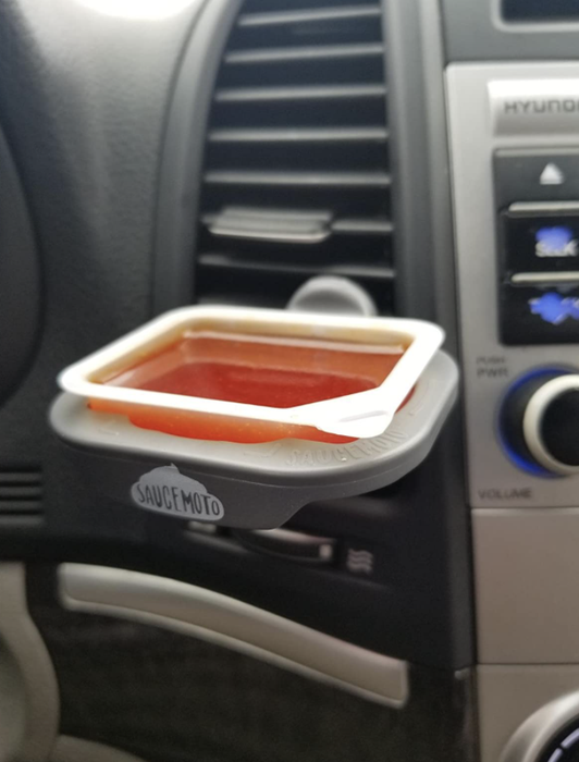 A close-up of the sauce dip clip