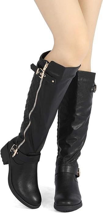 A model displaying the black version of the boots.