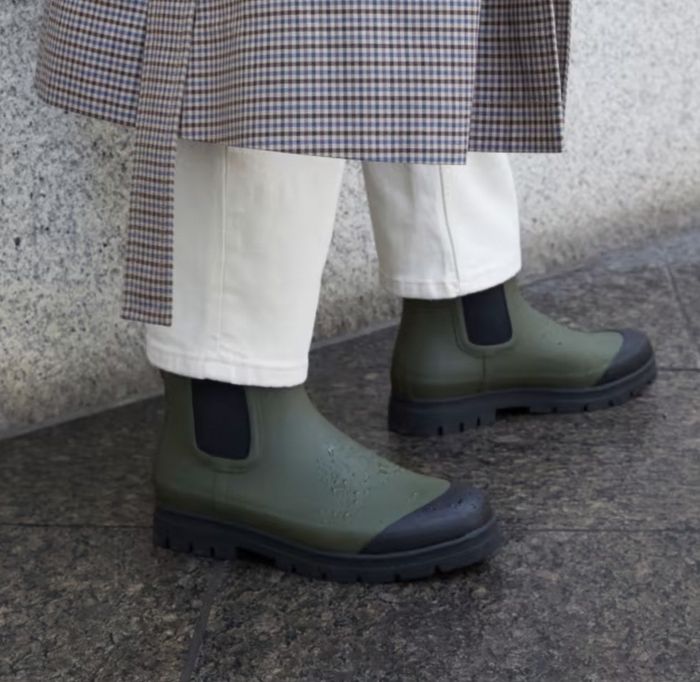 model showcasing the green rain boots