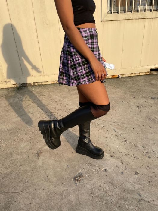 A reviewer wearing the black platform boots.