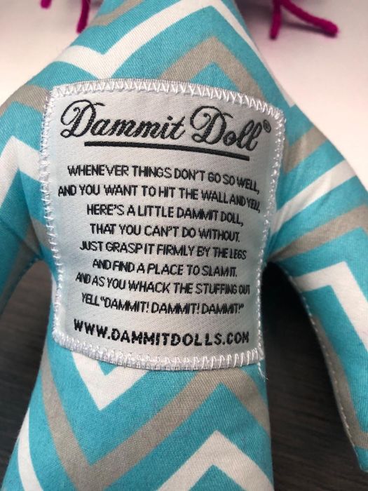 A close-up of the doll's patch that explains how to use it for maximum stress relief.
