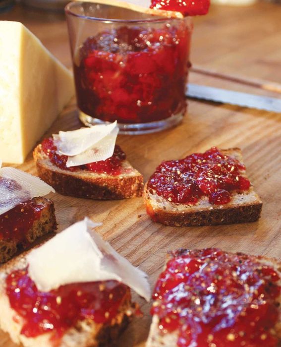 A crostini topped with jam and cheese
