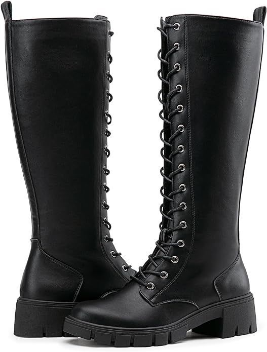 A detailed close-up of the boots in black, highlighting their sleek and stylish design.