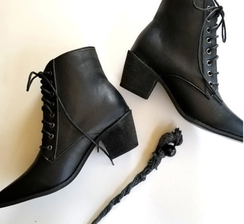 The boots placed next to a wand.