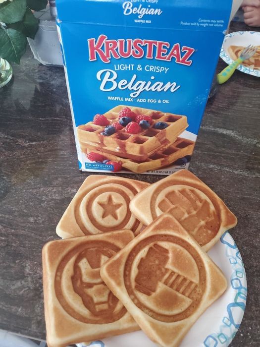 A reviewer’s four waffles, each featuring distinct symbols that are clearly visible on top