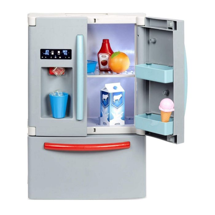 A toy refrigerator with double doors open, revealing toy food items like juice, milk, and an ice cream cone neatly arranged in its compartments.