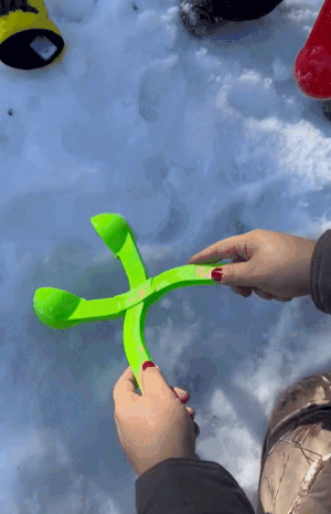 A gif showing a reviewer using a tool to perfectly shape a snowball.