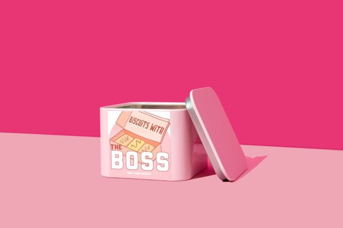 The pink tin featuring an illustration of the box Ted uses to deliver the cookies