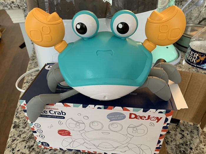 A blue toy crab, ready to scuttle around and entertain.