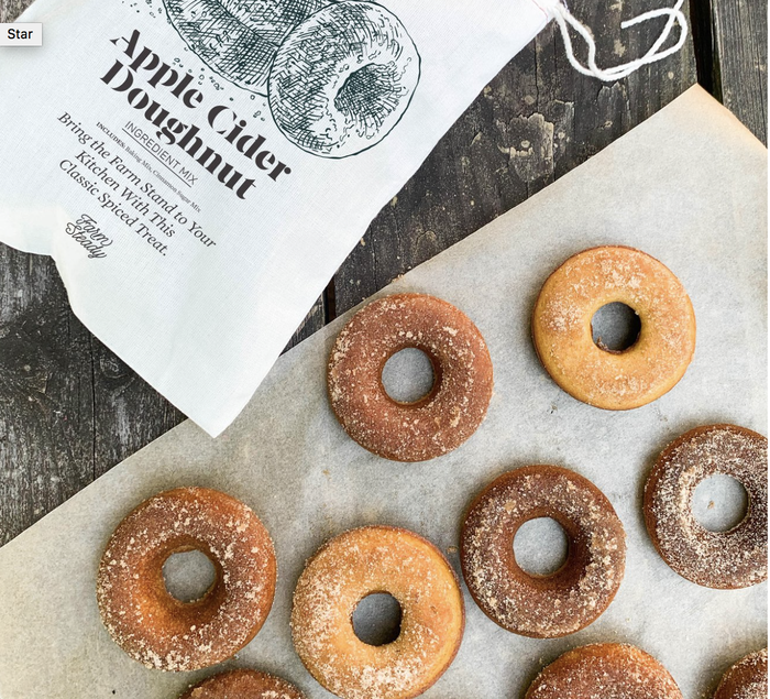 The kit packaging alongside freshly baked apple cider donuts.