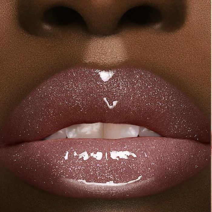 A model wearing the glittery pink-clear gloss