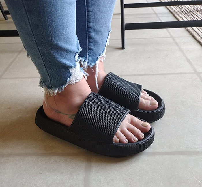 A reviewer is sporting the rubber slides in black.