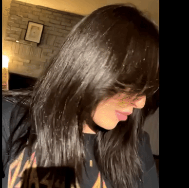 A GIF of the reviewer shaking their long, glossy hair with confidence.