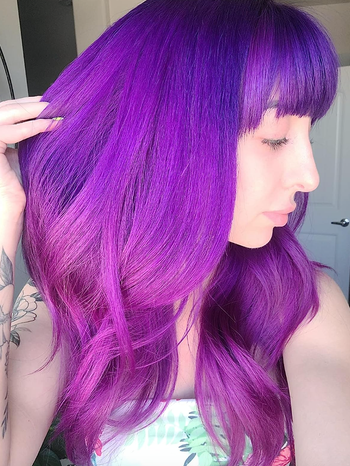 same reviewer proudly displaying a purple ombre hairstyle