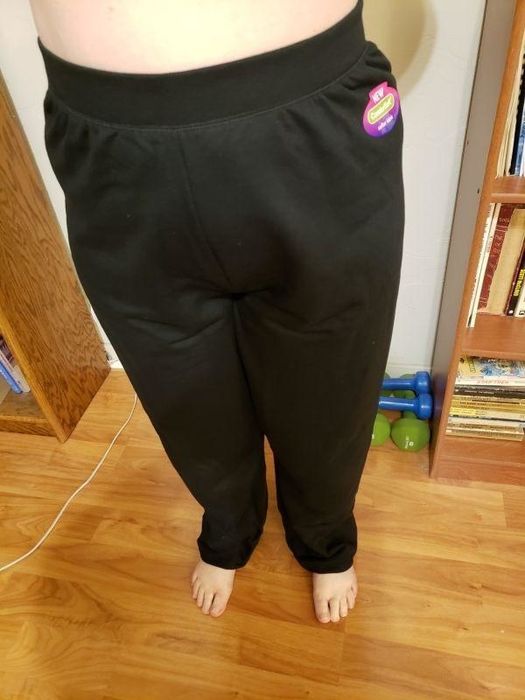 A reviewer wearing black sweatpants.