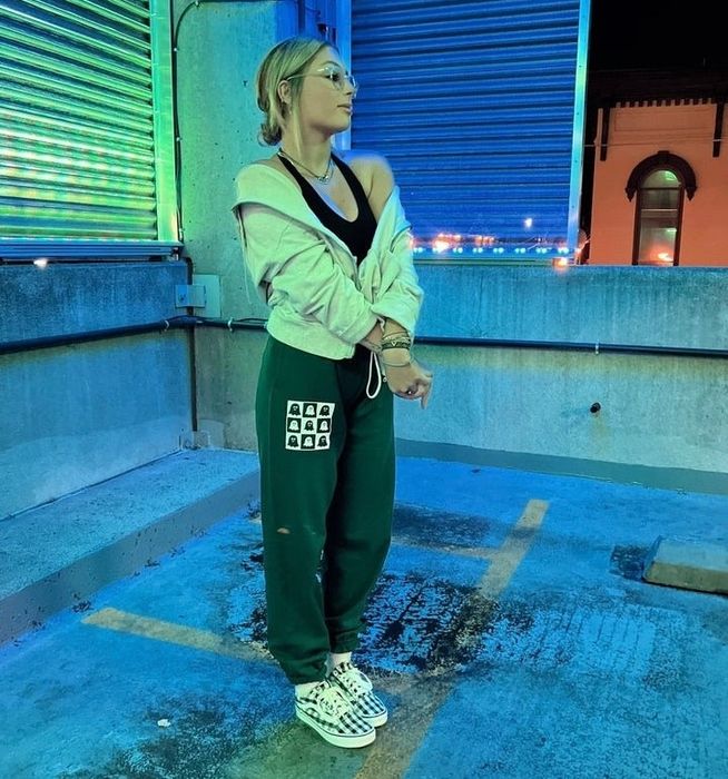 Model wearing the green ghost sweatpants.