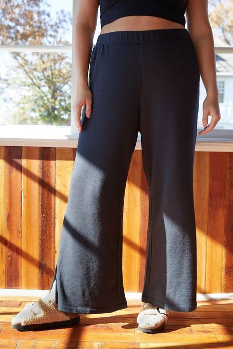 Model wearing the black lounge pants.