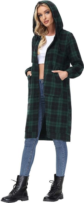 The model is wearing a green plaid long sweatshirt with the hood up.