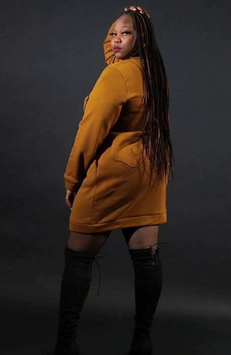 Back view of the reviewer wearing the yellow sweatshirt dress.