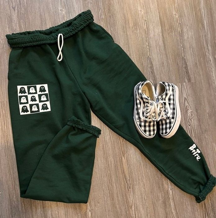 The green ghost sweatpants paired with a set of checkered tennis shoes.