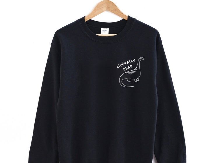 A black sweatshirt featuring a dinosaur graphic and the phrase: 'literally dead.'