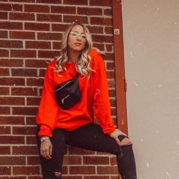reviewer wearing the red crewneck