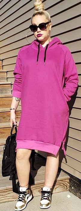 Reviewer wearing the pink hoodie dress.