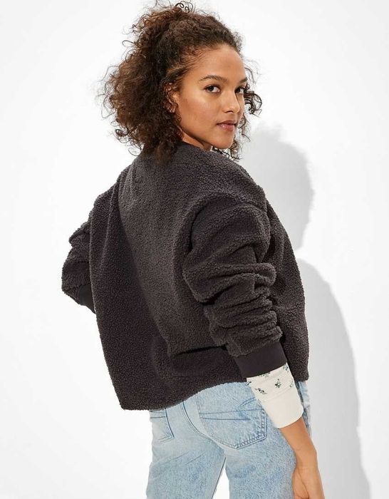 The back view of the model is showing off the black sweatshirt.