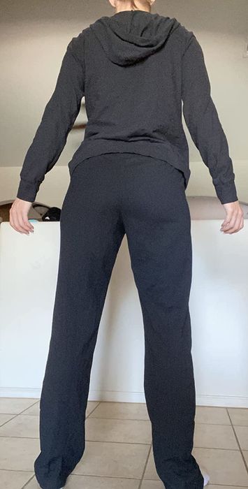 Back view of a reviewer sporting the black loungers.