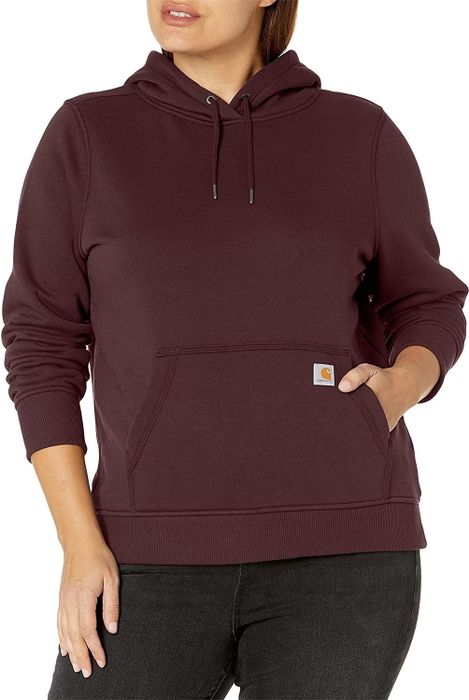 The model is wearing a maroon hoodie.