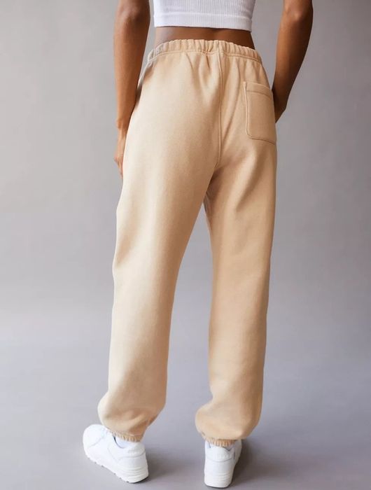 Back view of the model wearing the beige sweatpants.