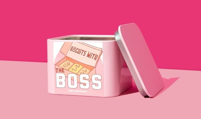 A pink tin featuring an illustration of the same pink box that Ted uses to carry the cookies.