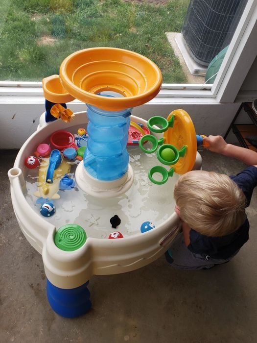 The reviewer’s child having fun with the water table.