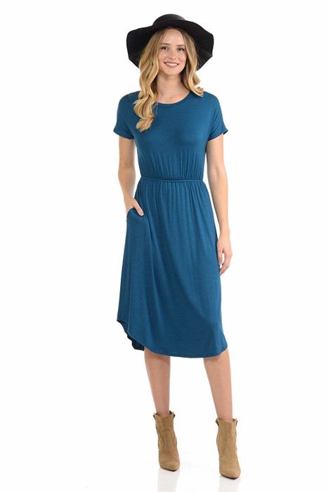 A model rocking a cinched waist midi dress in a stunning shade of blue.