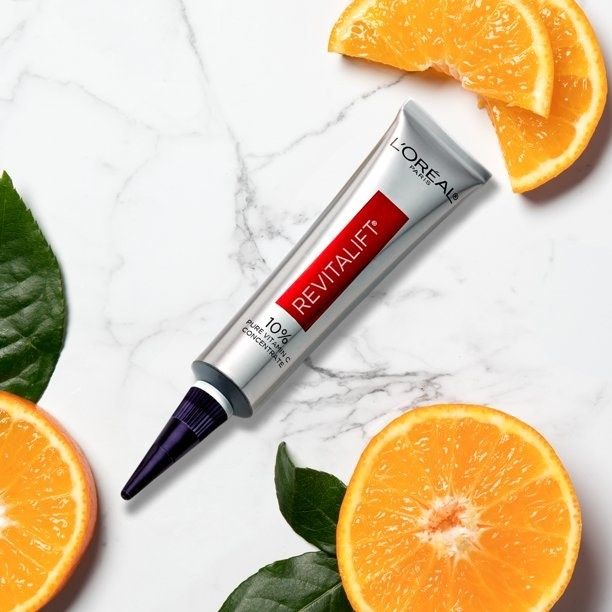 The serum placed next to fresh oranges