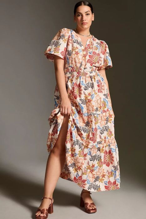 A model wears the dress in a stunning botanical pattern.