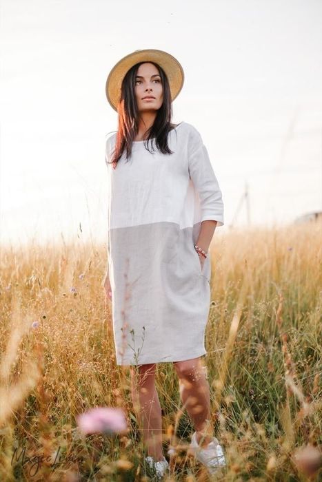 A model showcasing a gray and white linen dress.