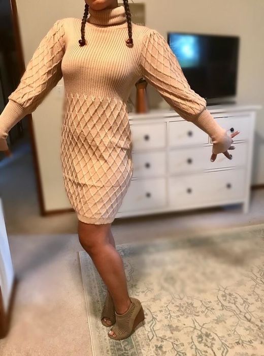 Reviewer styling the turtleneck dress with confidence