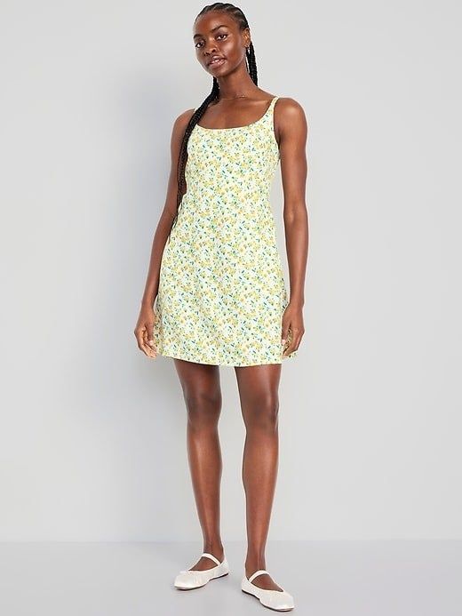 A model wearing a mini dress featuring lemons