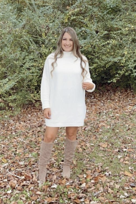 A customer review photo shows them wearing the dress in a field surrounded by foliage.