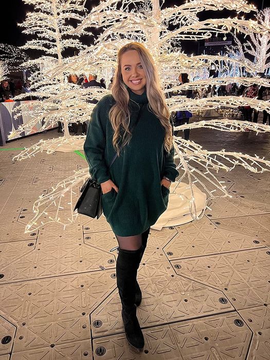 A customer review photo showing them wearing the dress in a dark green shade.