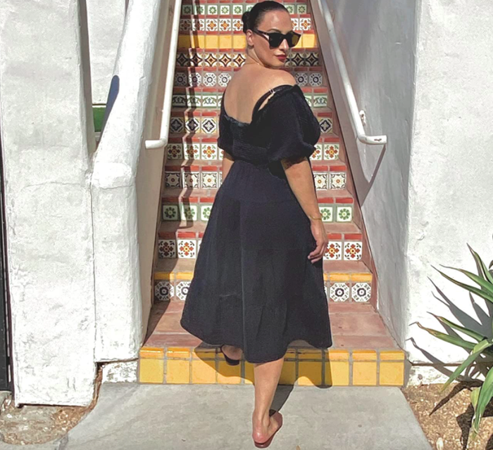 A customer review photo of them wearing the dress in classic black