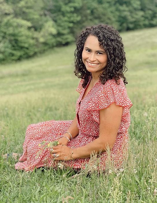 A reviewer in a red dress