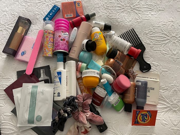 A photo of a pile of all the products scattered on a bed.