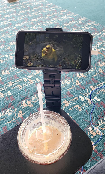 The same device used to hold a phone upright on a flat table surface