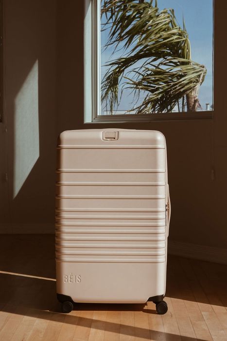 a beige-colored suitcase on display