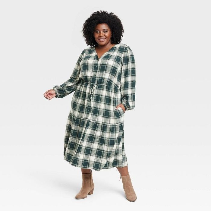 A model showcasing the dress in green plaid
