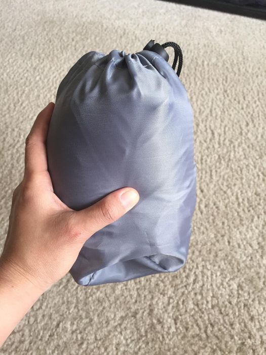 The reviewer demonstrates how compact it becomes when deflated and not in use.